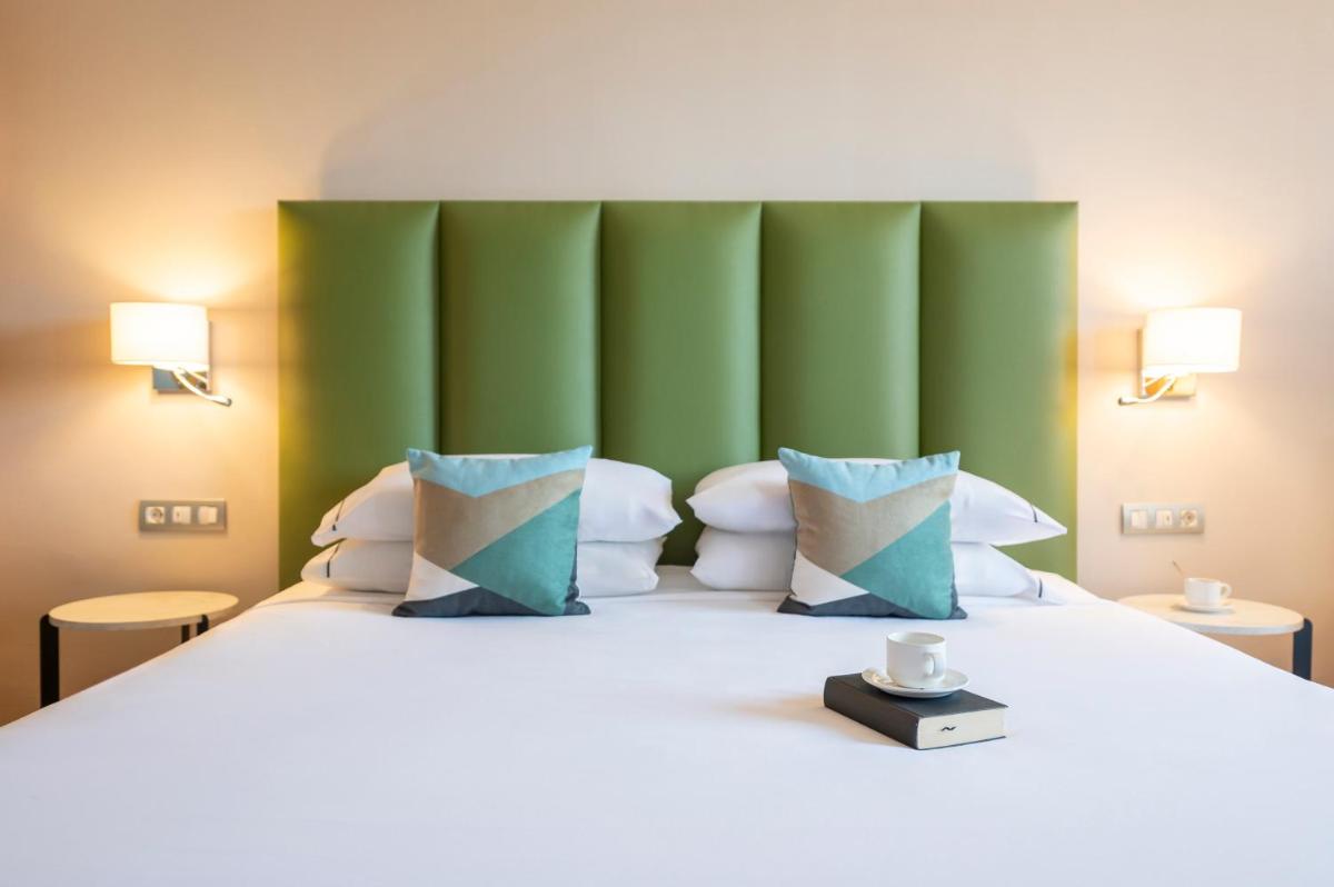 Cama o camas de una habitación en Hesperia Barcelona Sant Just