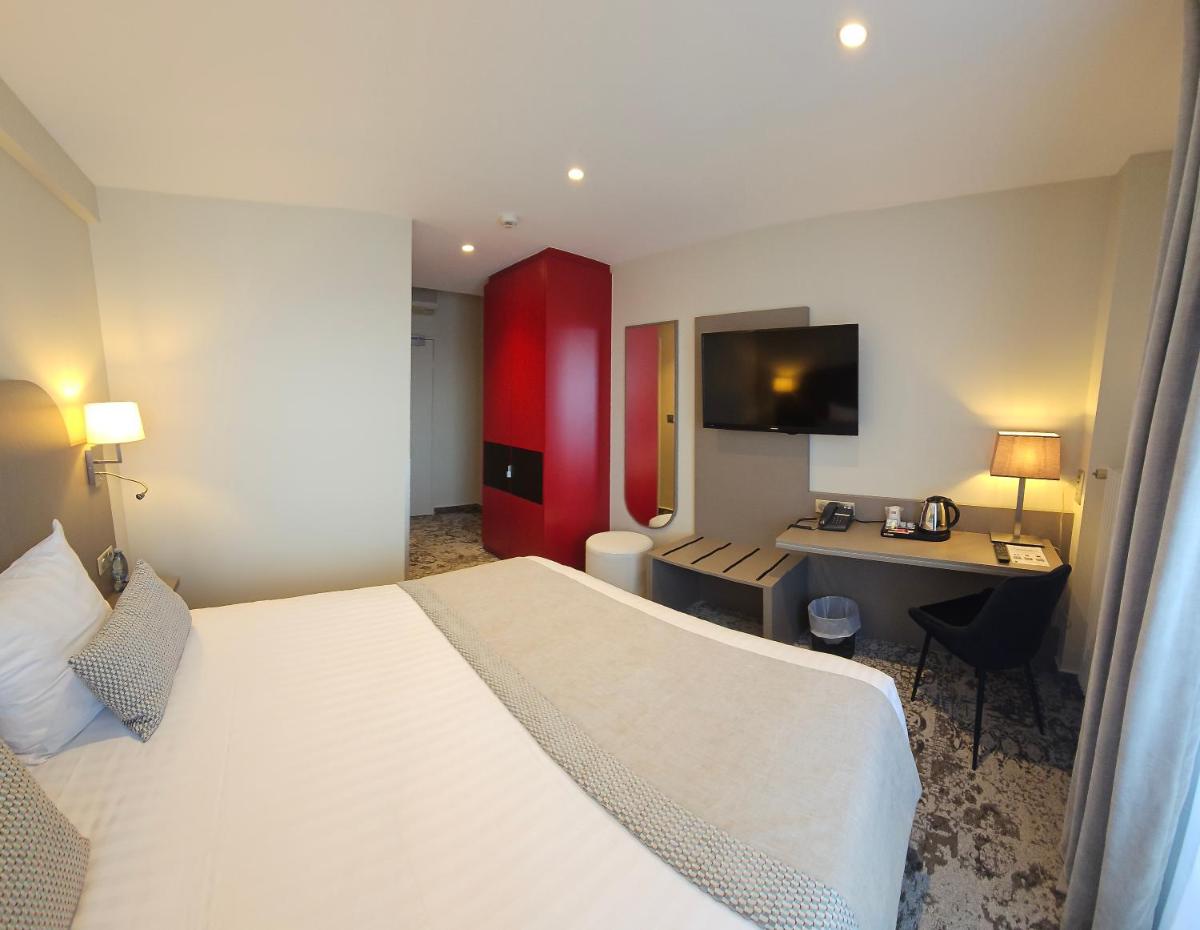 Un ou plusieurs lits dans un hébergement de l'établissement Europe Haguenau – Hotel & Spa