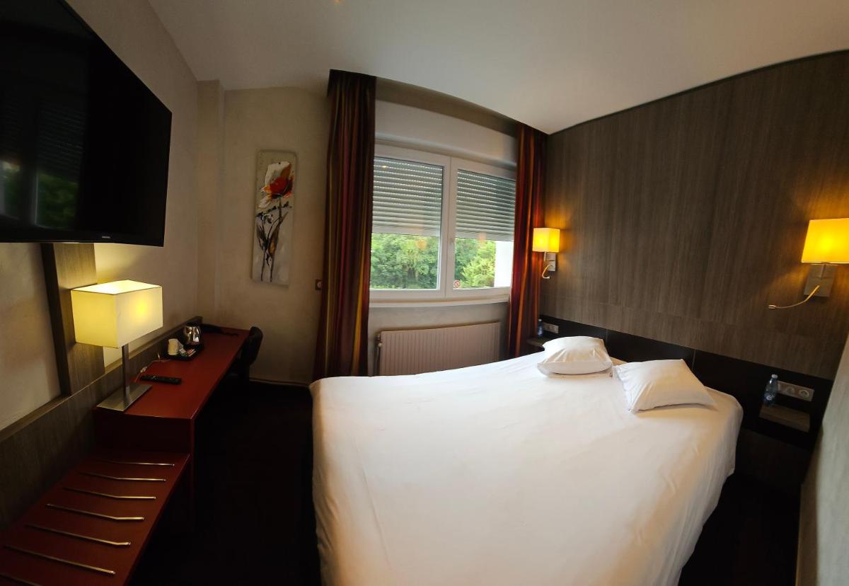 Un ou plusieurs lits dans un hébergement de l'établissement Europe Haguenau – Hotel & Spa