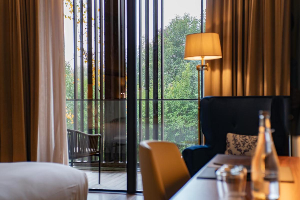 Uma área de estar em Boeira Garden Hotel Porto Gaia, Curio Collection by Hilton