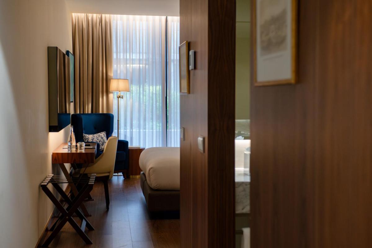 Uma área de estar em Boeira Garden Hotel Porto Gaia, Curio Collection by Hilton