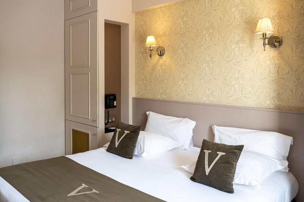 Un ou plusieurs lits dans un hébergement de l'établissement Le Vallon de Valrugues Hotel Spa & Villas