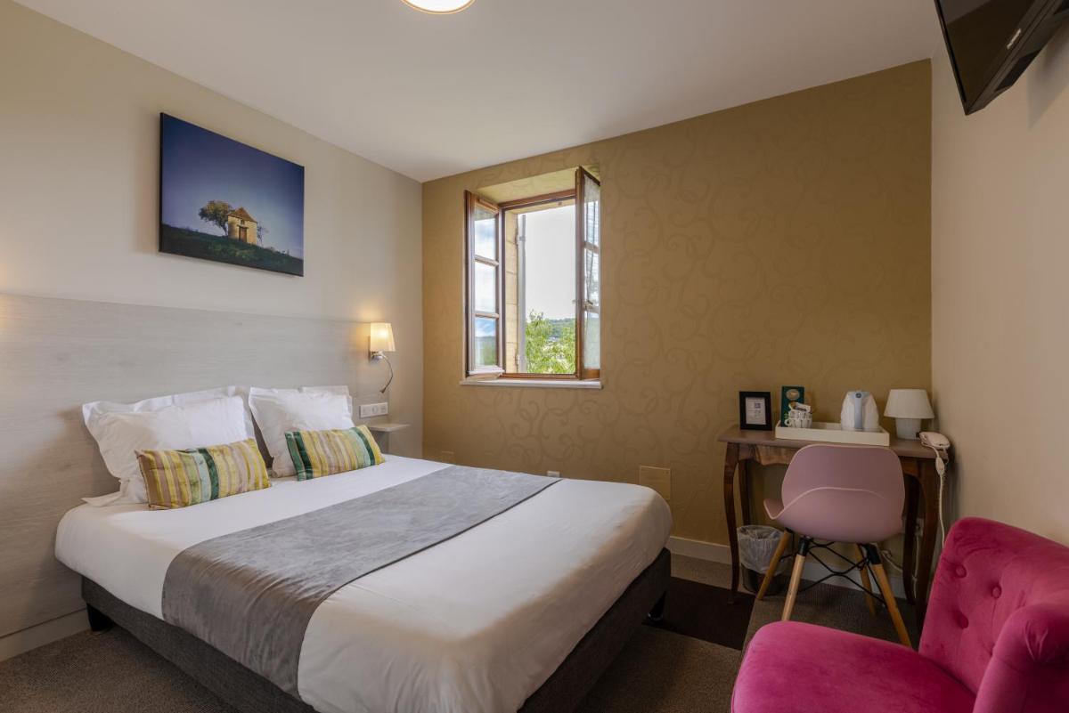Un ou plusieurs lits dans un hébergement de l'établissement Logis Hotel Archambeau