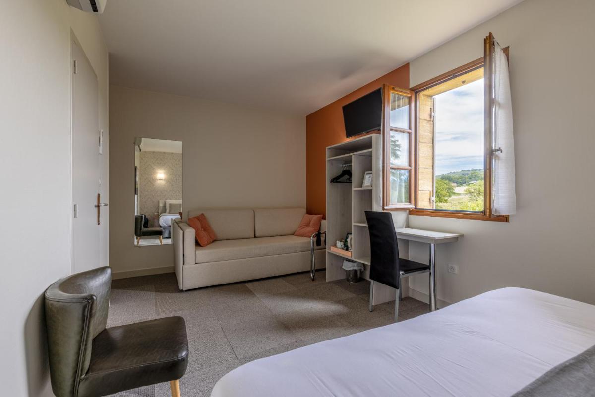 Un ou plusieurs lits dans un hébergement de l'établissement Logis Hotel Archambeau