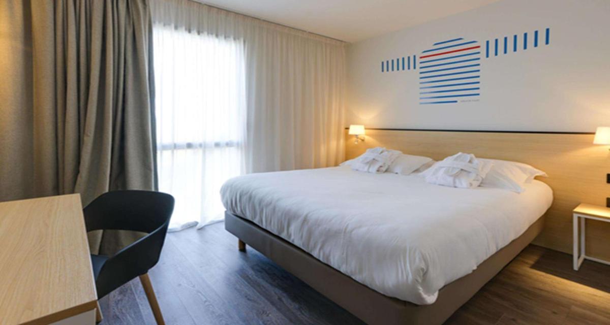 Un ou plusieurs lits dans un hébergement de l'établissement Best Western Armor Park Dinan et Spa
