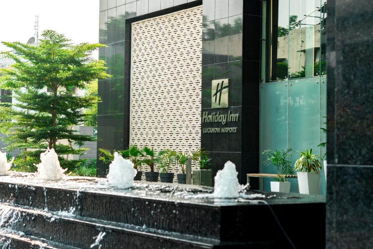 a water fountain in front of a building at Holiday Inn Lucknow Airport by IHG in Lucknow
