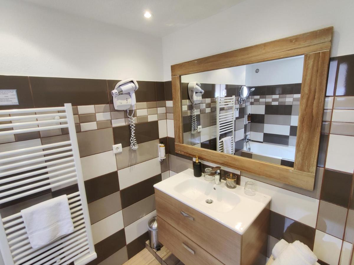 Salle de bains dans l'établissement Le Roc E Fiori Hotel - Teritoria