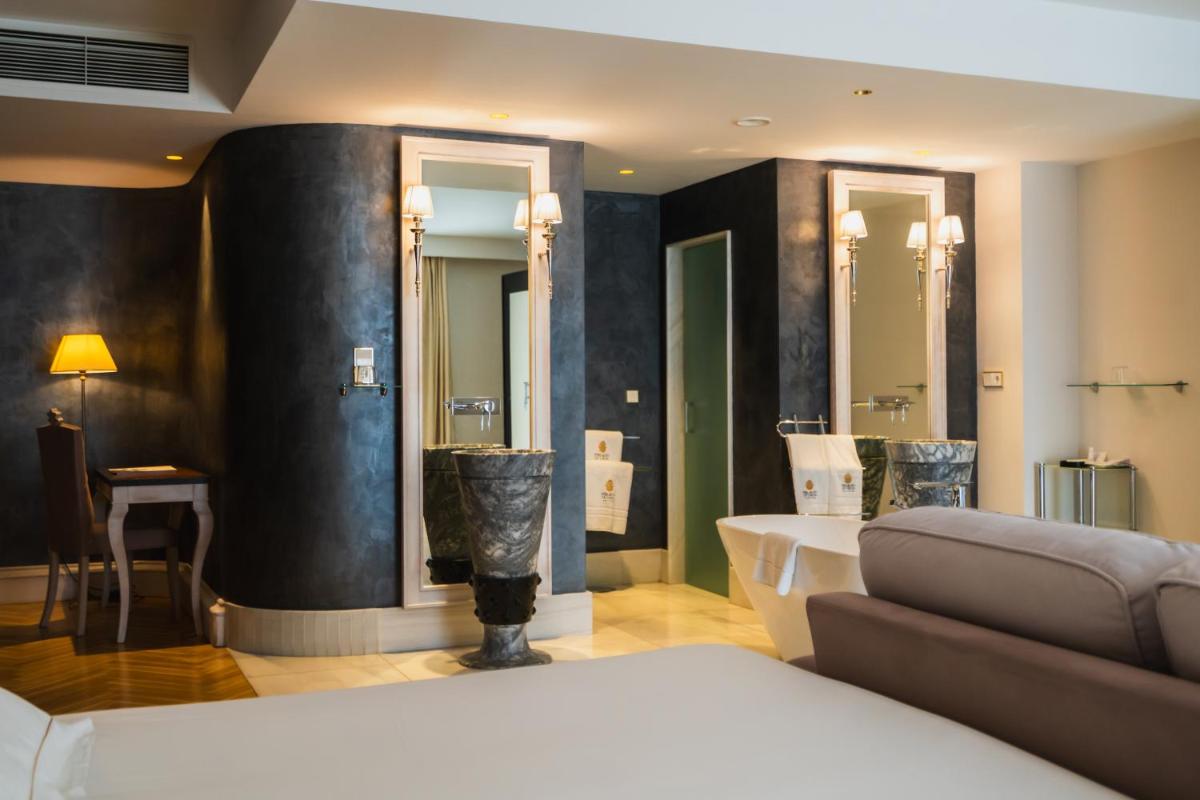 Cama o camas de una habitación en Hotel Palacio De Úbeda 5 G.L