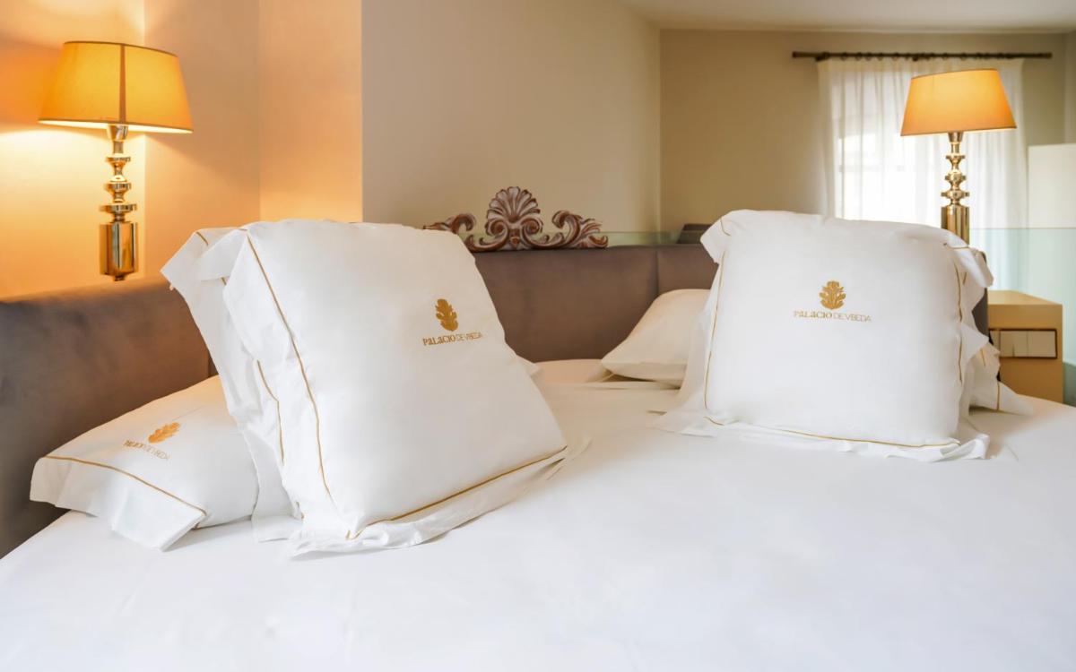 Cama o camas de una habitación en Hotel Palacio De Úbeda 5 G.L
