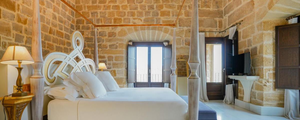 Cama o camas de una habitación en Hotel Palacio De Úbeda 5 G.L