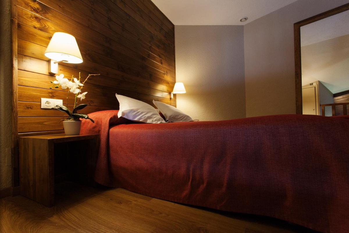 Cama o camas de una habitación en Tuc Blanc
