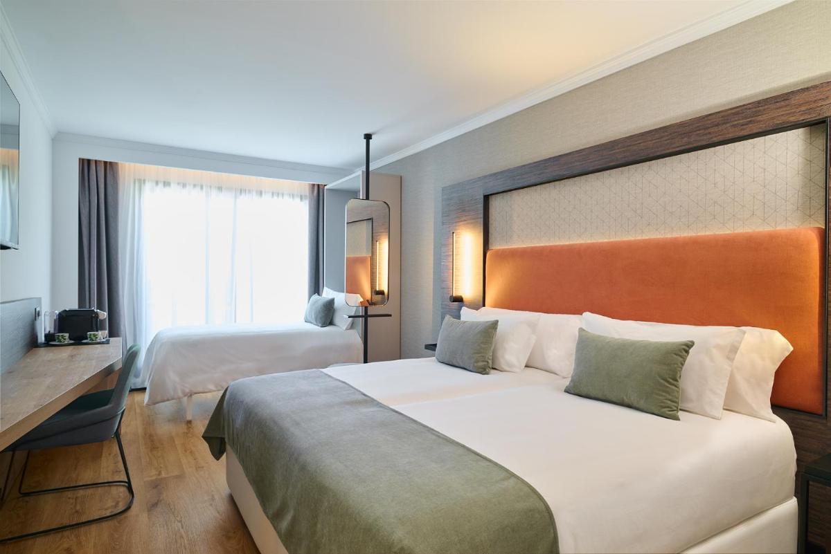 Cama o camas de una habitación en Gran Hotel Luna de Granada