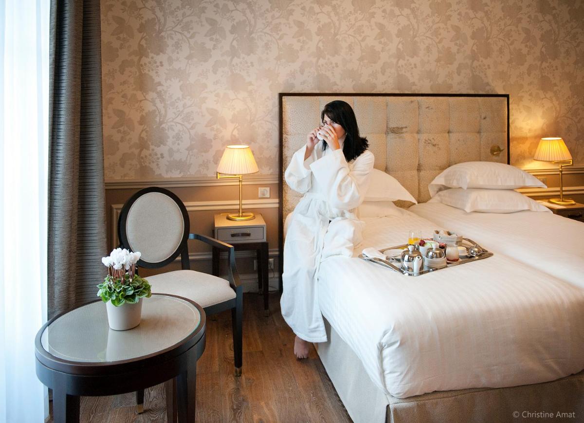 Un ou plusieurs lits dans un hébergement de l'établissement Hôtel de Sèze & Spa Bordeaux Centre