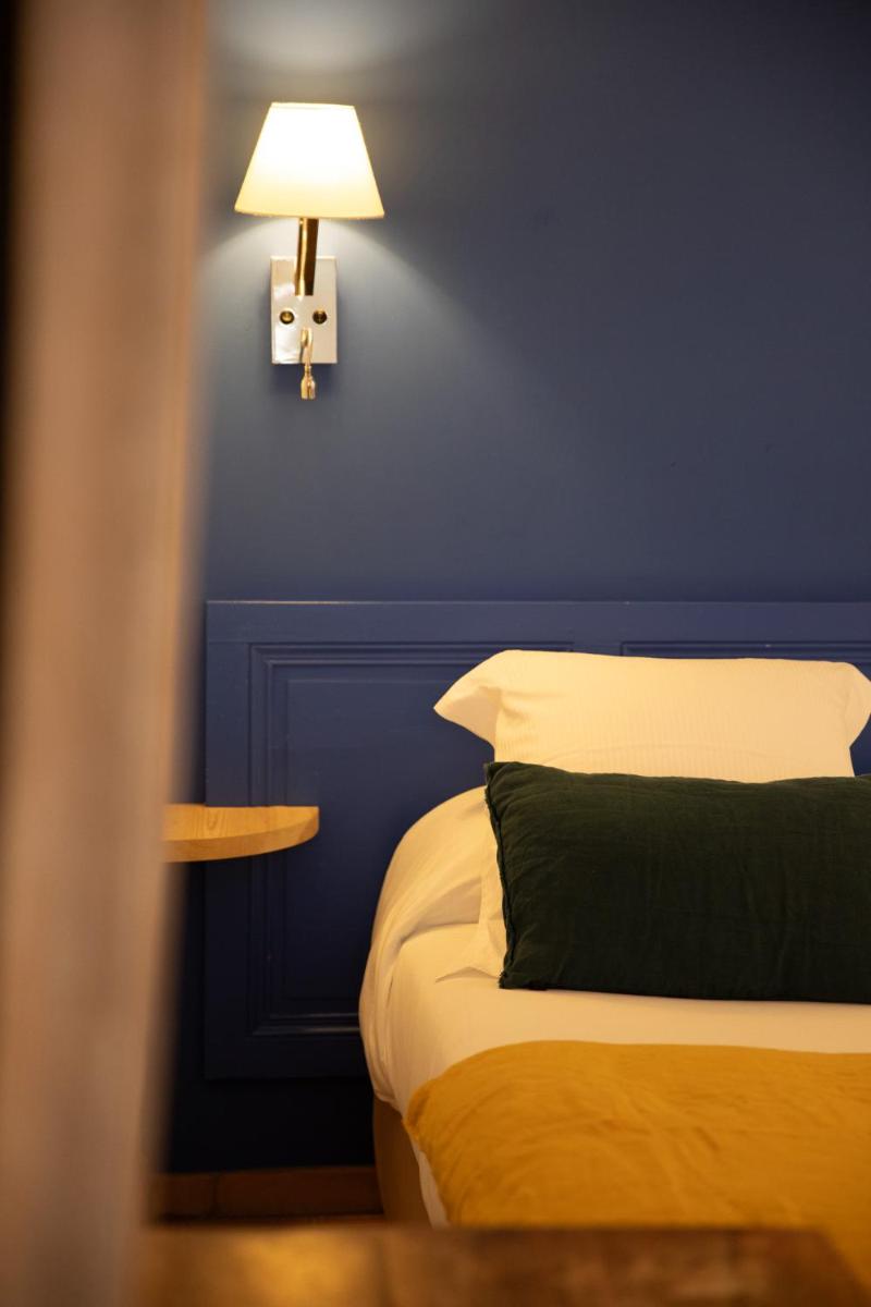 Un ou plusieurs lits dans un hébergement de l'établissement Oustau Camarguen Hôtel & Spa