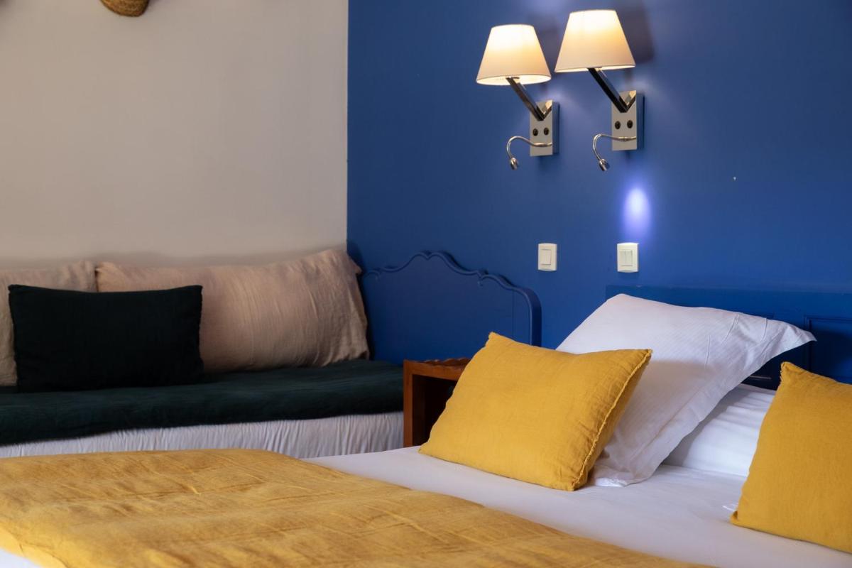 Un ou plusieurs lits dans un hébergement de l'établissement Oustau Camarguen Hôtel & Spa