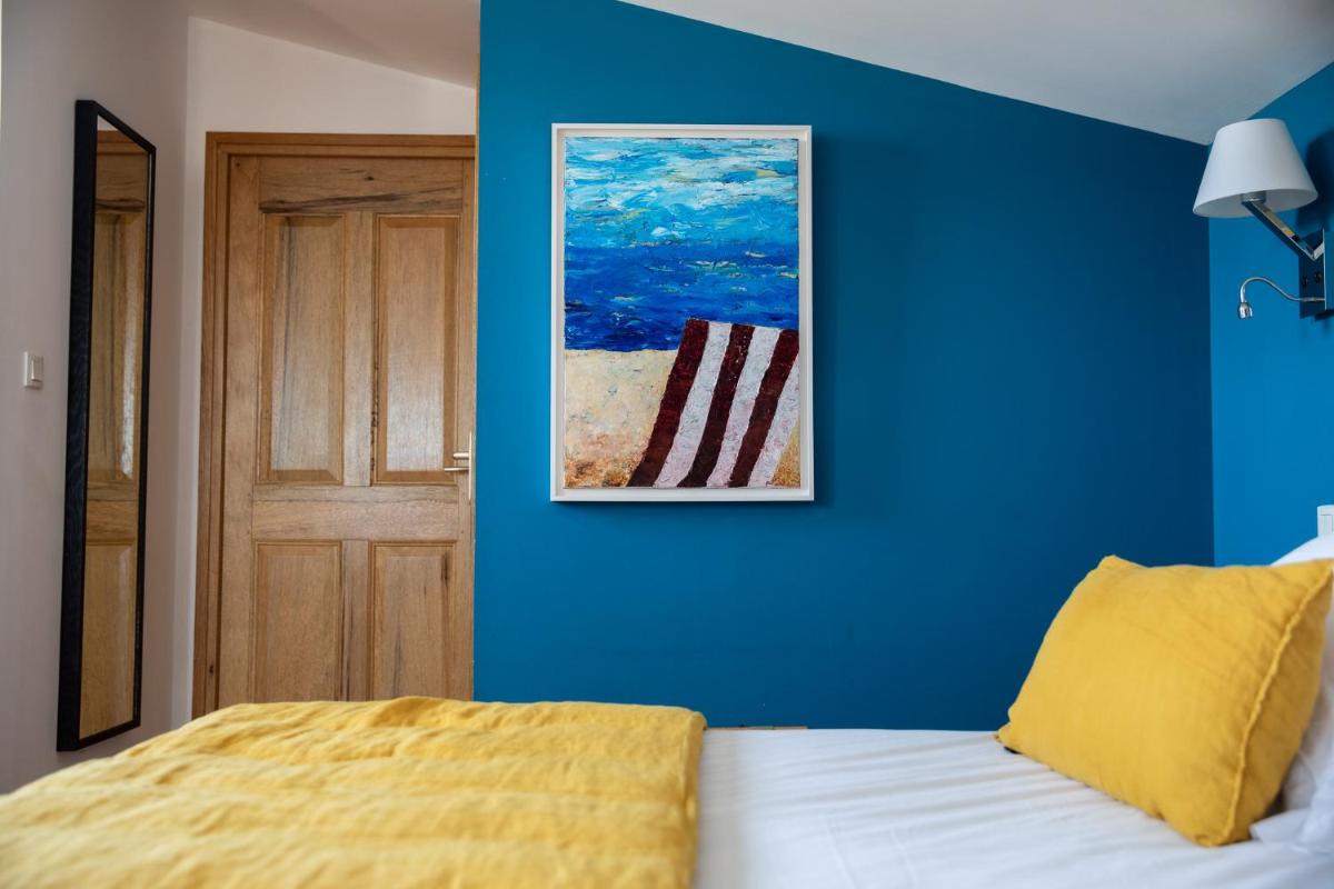 Un ou plusieurs lits dans un hébergement de l'établissement Oustau Camarguen Hôtel & Spa