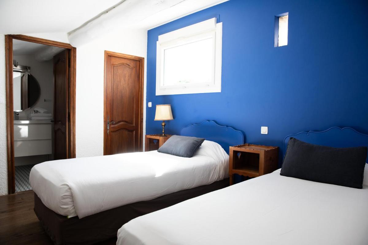 Un ou plusieurs lits dans un hébergement de l'établissement Oustau Camarguen Hôtel & Spa