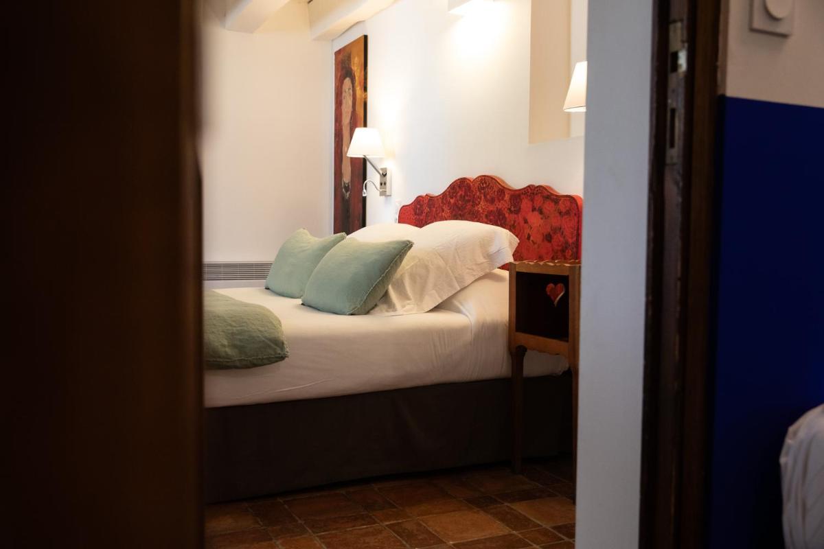 Un ou plusieurs lits dans un hébergement de l'établissement Oustau Camarguen Hôtel & Spa
