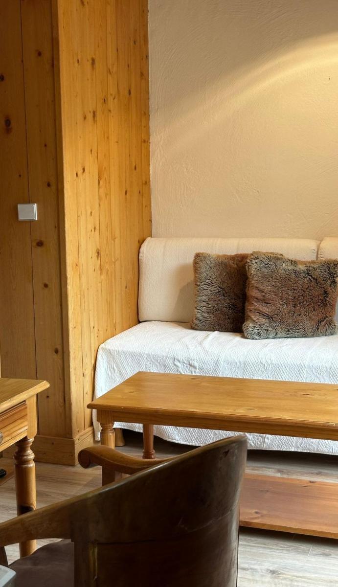 Un ou plusieurs lits dans un hébergement de l'établissement Hôtel Le Jeu de Paume