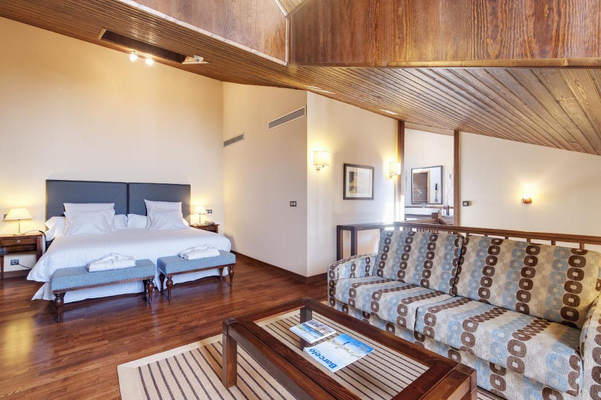 Cama o camas de una habitación en Hotel & Spa Real Badaguás Jaca