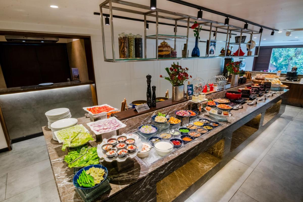 a buffet line with many different types of food at Southern Star,Mysore in Mysore