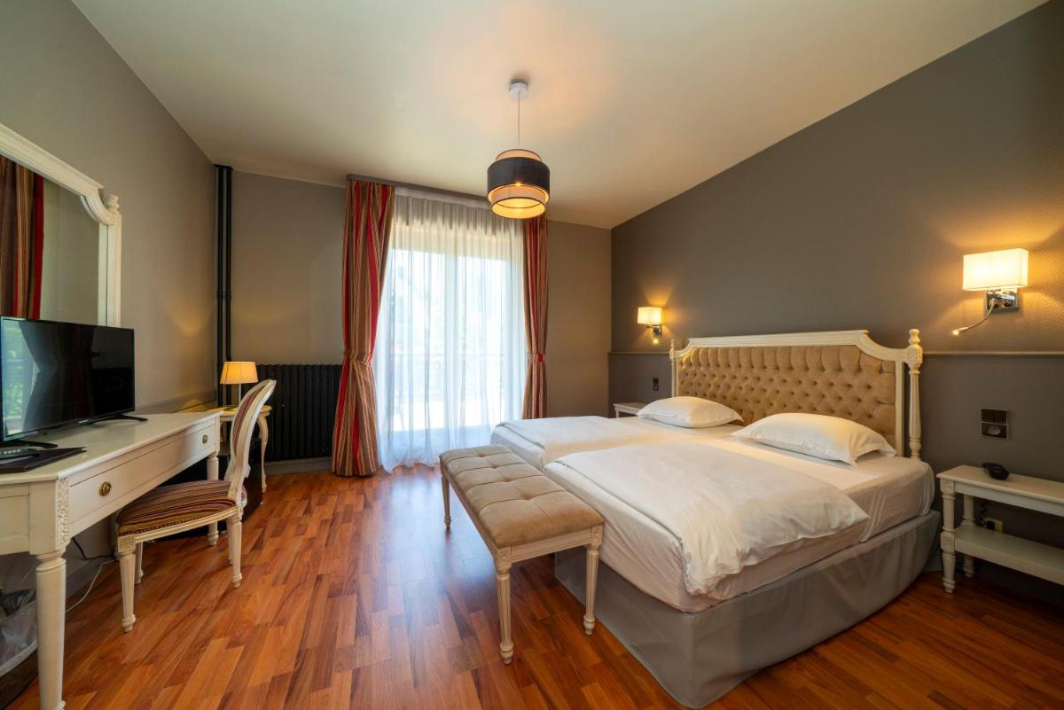 Un ou plusieurs lits dans un hébergement de l'établissement Hôtel du Parc, Restaurant, Spa & Wellness
