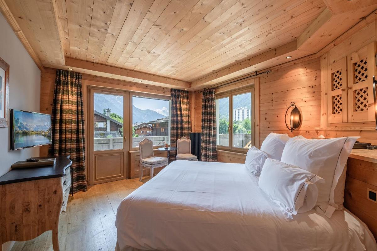 Un ou plusieurs lits dans un hébergement de l'établissement Chalet-Hôtel Hermitage