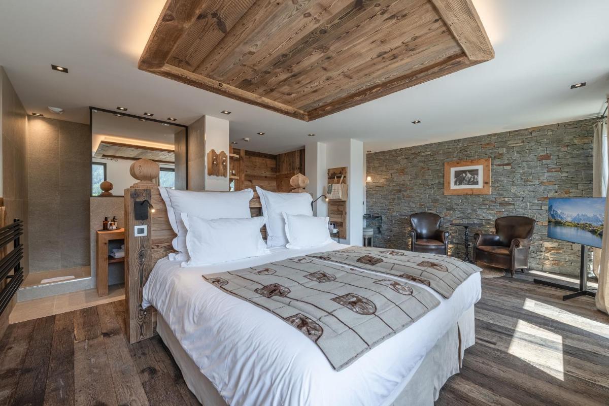 Un ou plusieurs lits dans un hébergement de l'établissement Chalet-Hôtel Hermitage