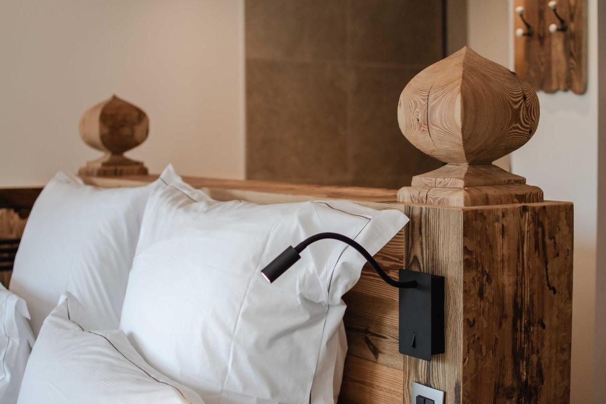 Un ou plusieurs lits dans un hébergement de l'établissement Chalet-Hôtel Hermitage