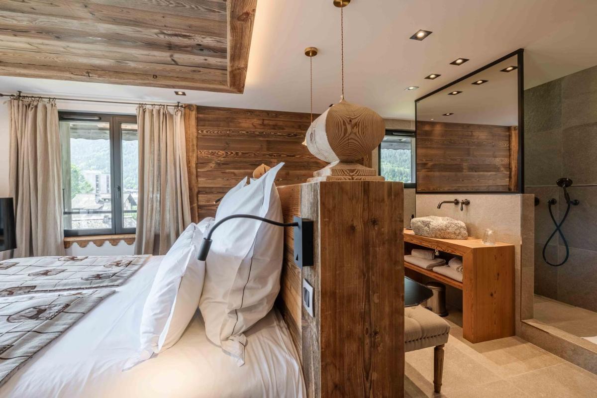 Un ou plusieurs lits dans un hébergement de l'établissement Chalet-Hôtel Hermitage