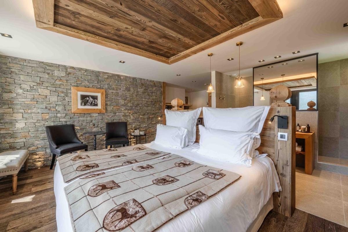 Un ou plusieurs lits dans un hébergement de l'établissement Chalet-Hôtel Hermitage