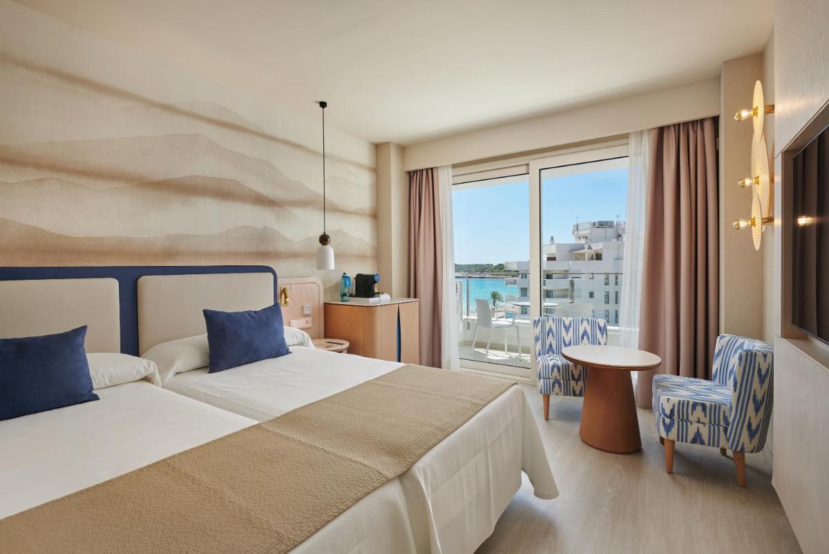 Cama o camas de una habitación en Hipotels Flamenco