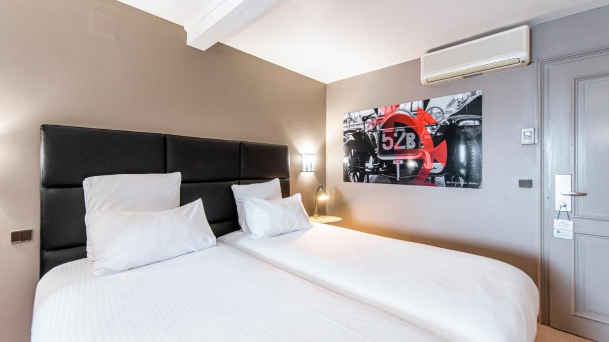 Un ou plusieurs lits dans un hébergement de l'établissement Best Western Plus Au cheval Blanc à Mulhouse
