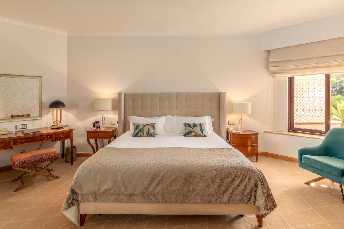 Uma cama ou camas num quarto em Hotel Quinta do Lago