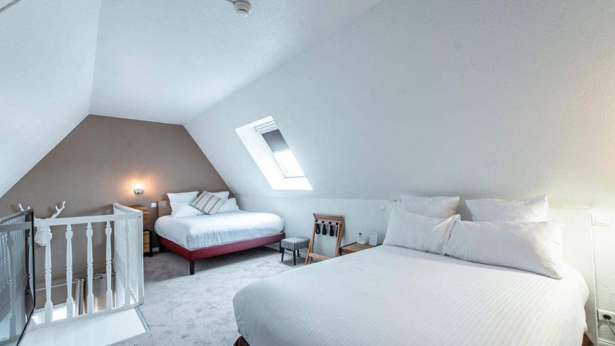 Un ou plusieurs lits dans un hébergement de l'établissement Best Western Plus Au cheval Blanc à Mulhouse