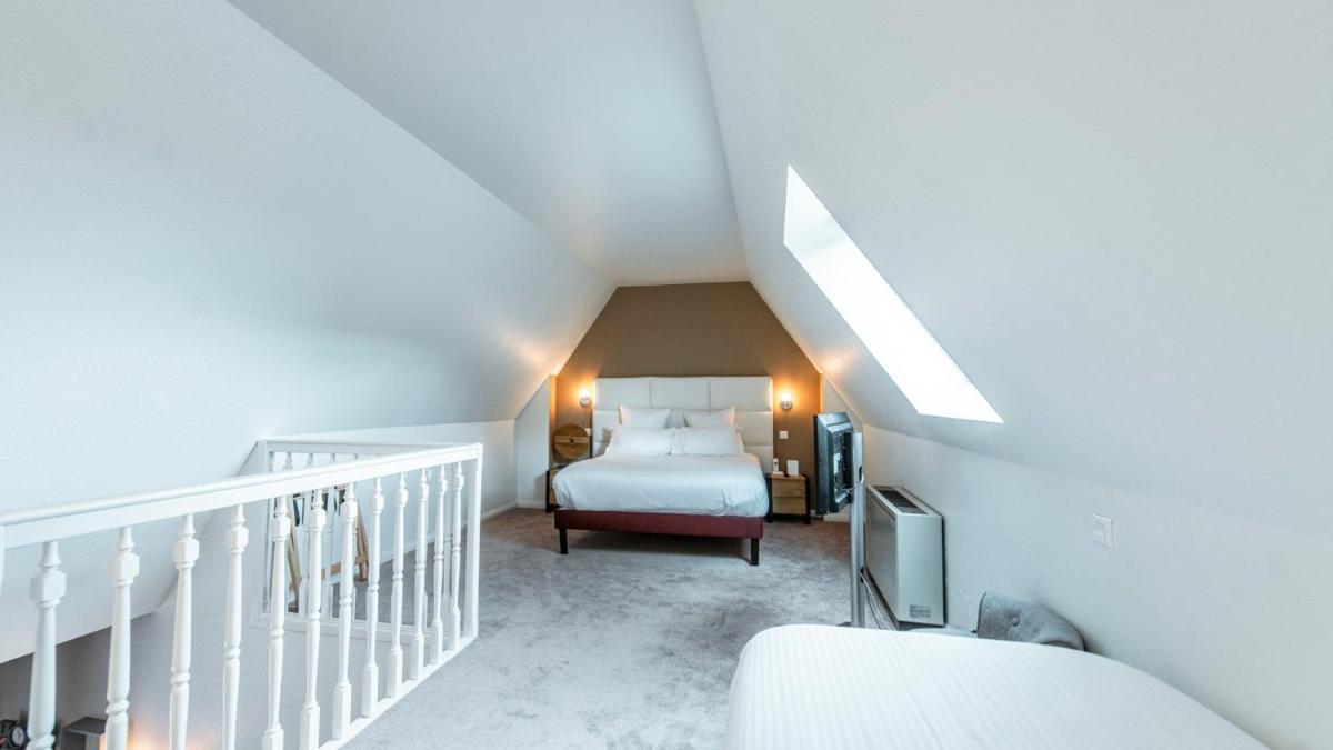 Un ou plusieurs lits dans un hébergement de l'établissement Best Western Plus Au cheval Blanc à Mulhouse