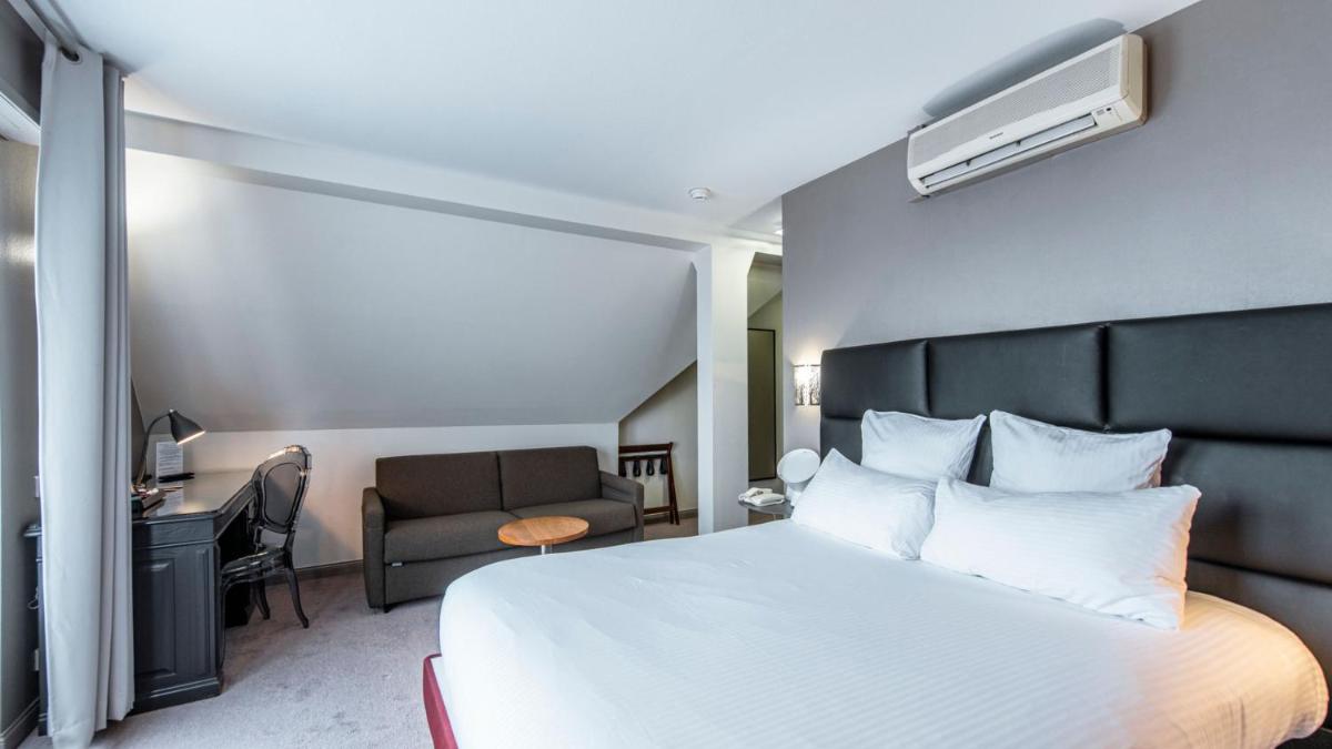 Un ou plusieurs lits dans un hébergement de l'établissement Best Western Plus Au cheval Blanc à Mulhouse