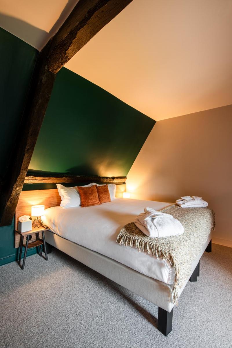 Un ou plusieurs lits dans un hébergement de l'établissement La Maison OBONO Hôtel & Spa