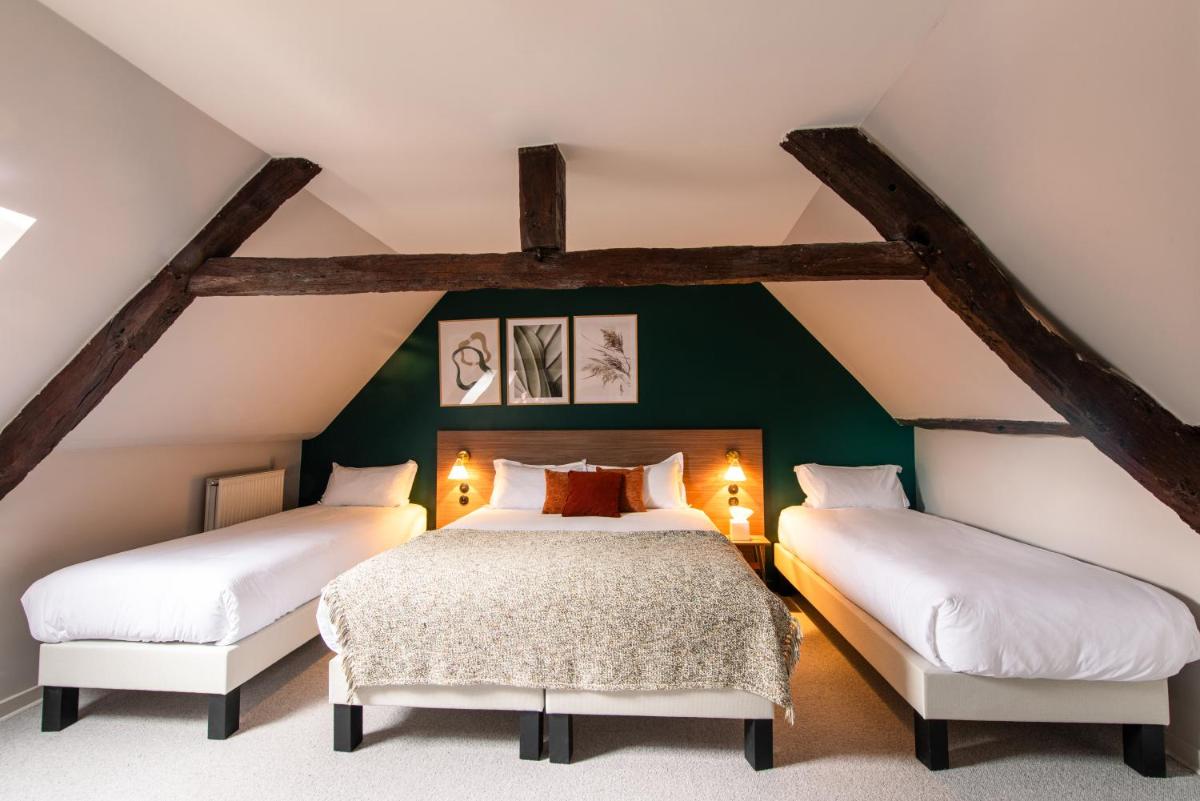 Un ou plusieurs lits dans un hébergement de l'établissement La Maison OBONO Hôtel & Spa
