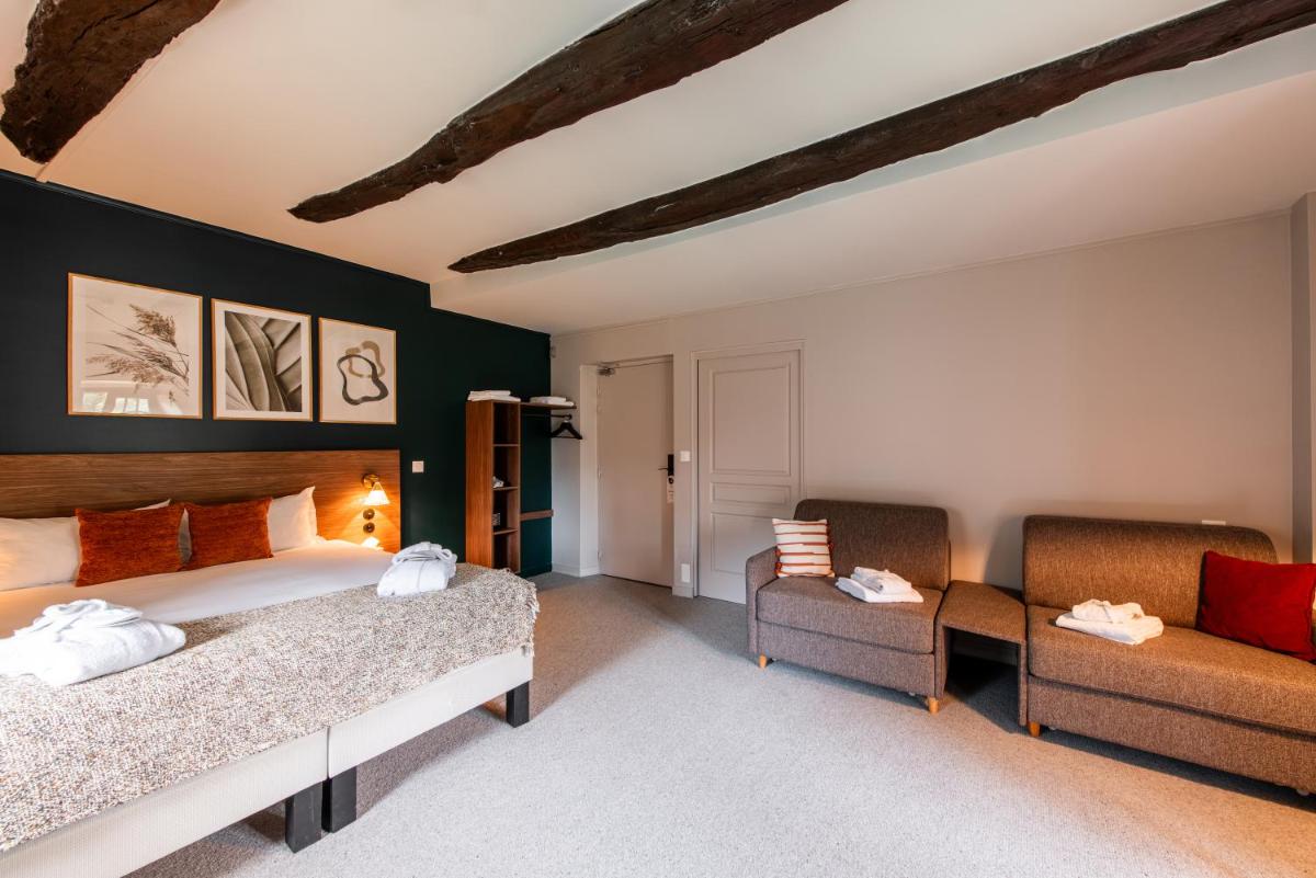 Un ou plusieurs lits dans un hébergement de l'établissement La Maison OBONO Hôtel & Spa