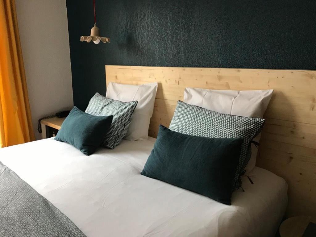 Un ou plusieurs lits dans un hébergement de l'établissement Hotel Spa Azteca Barcelonnette