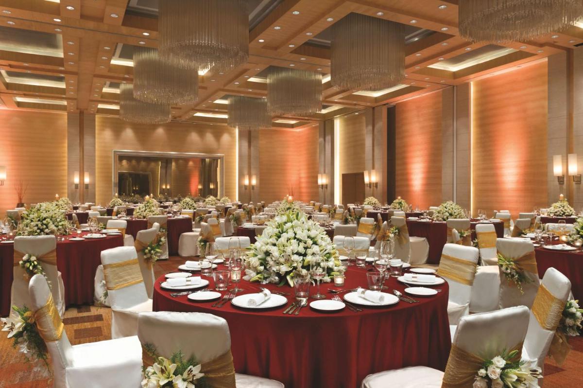 a large banquet hall with tables and chairs at Hyatt Regency Chennai in Chennai
