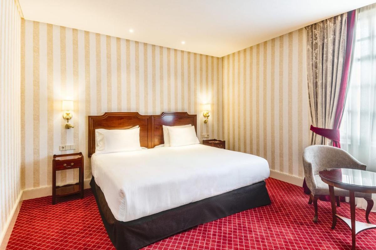 Cama o camas de una habitación en Eurostars Hotel de la Reconquista