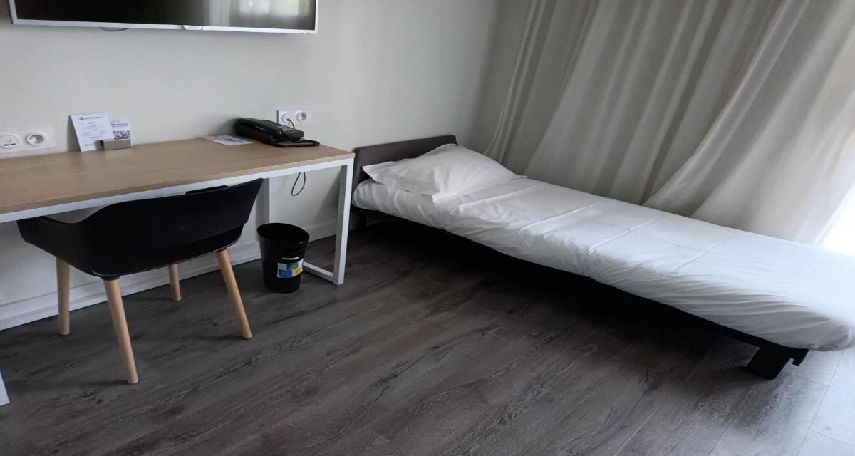 Un ou plusieurs lits dans un hébergement de l'établissement Best Western Armor Park Dinan et Spa