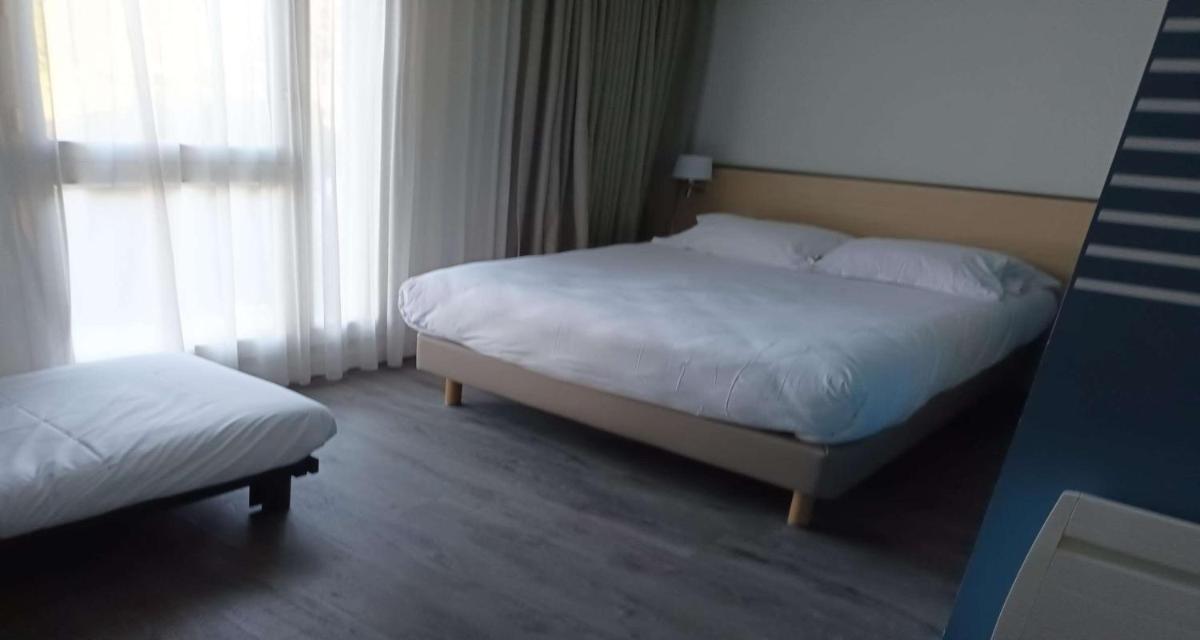 Un ou plusieurs lits dans un hébergement de l'établissement Best Western Armor Park Dinan et Spa