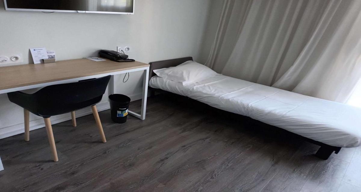 Un ou plusieurs lits dans un hébergement de l'établissement Best Western Armor Park Dinan et Spa