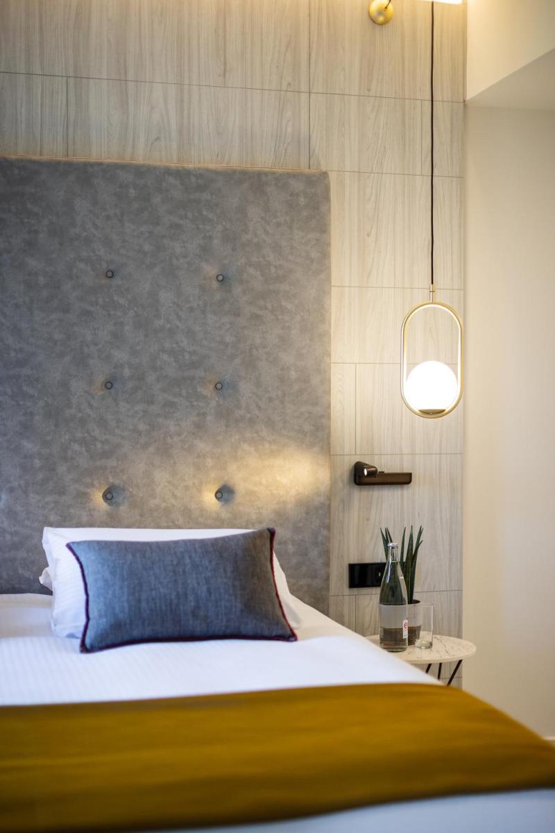 Un ou plusieurs lits dans un hébergement de l'établissement Domaine de Dolomieu Hotel & Spa - BW Premier Collection