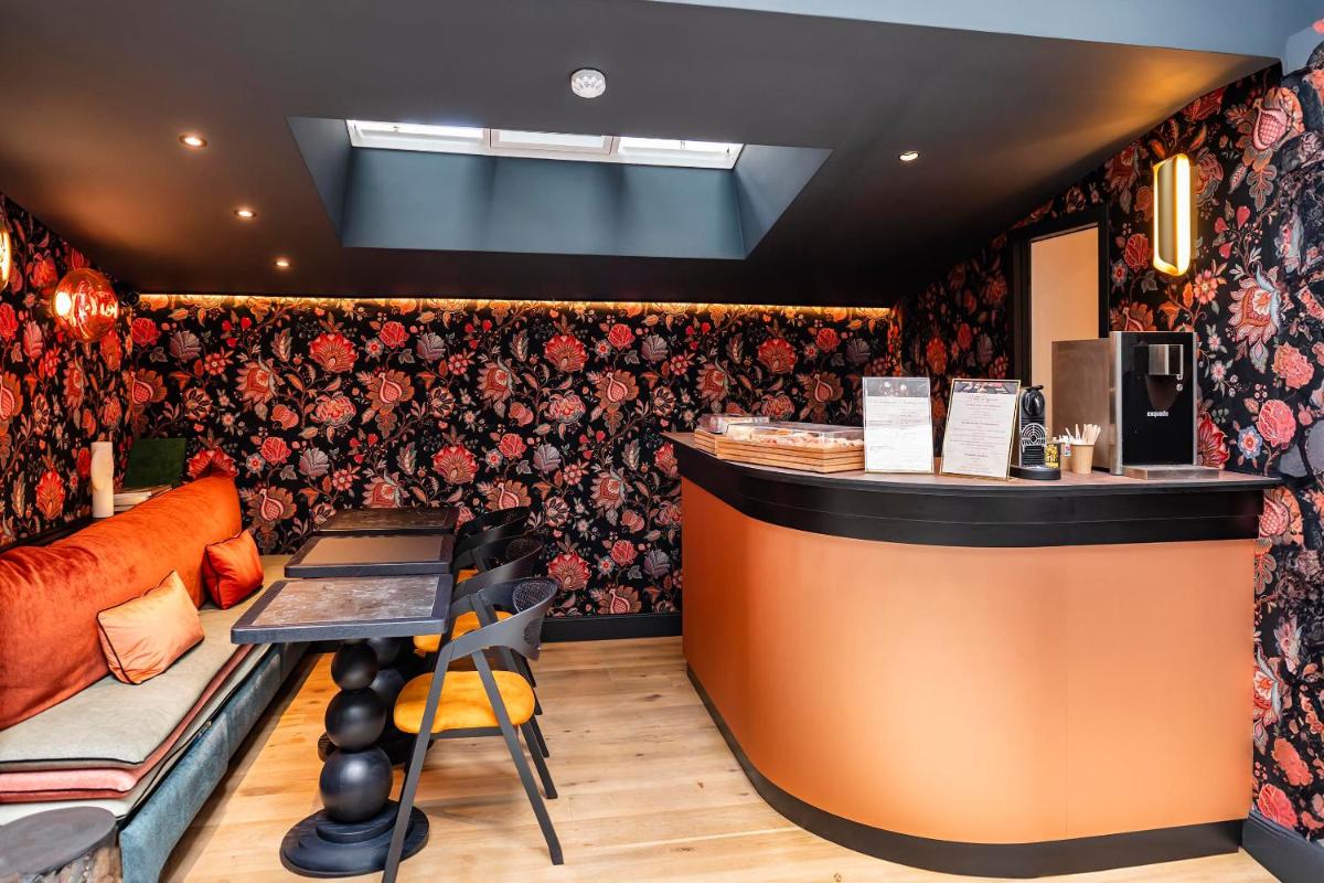 Coin salon dans l'établissement Hôtel Hiro Paris