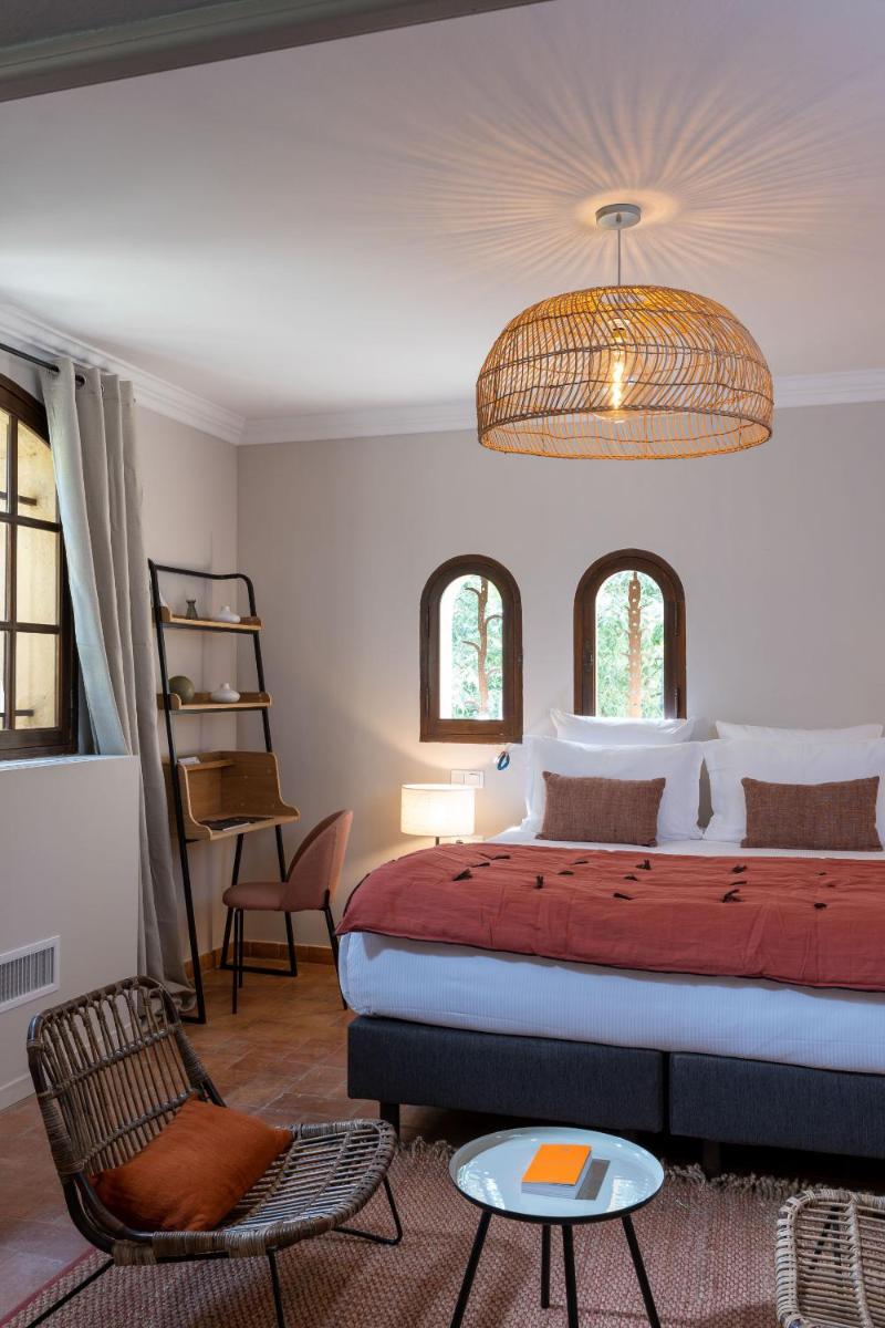 Un ou plusieurs lits dans un hébergement de l'établissement Hôtel - Restaurant & Spa La Magdeleine - Mathias Dandine