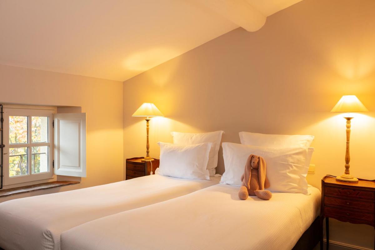 Un ou plusieurs lits dans un hébergement de l'établissement Hôtel - Restaurant & Spa La Magdeleine - Mathias Dandine